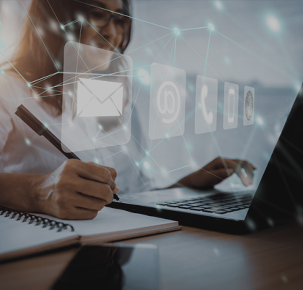 HR consultant using laptop and digital communication tools to manage client enquiries and provide HR support services.