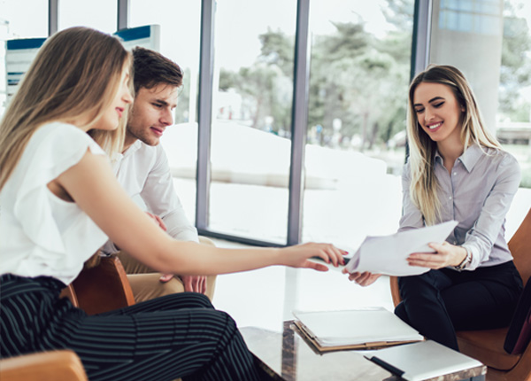 HR consultant meeting with business clients, discussing HR solutions and workforce management strategies.