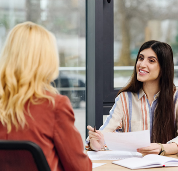 HR consultant providing tailored HR advice and compliance support to a business client during a meeting.